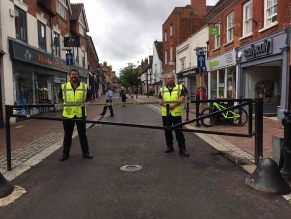 Security contractors Lee and Tony man the barrier in the High Street.