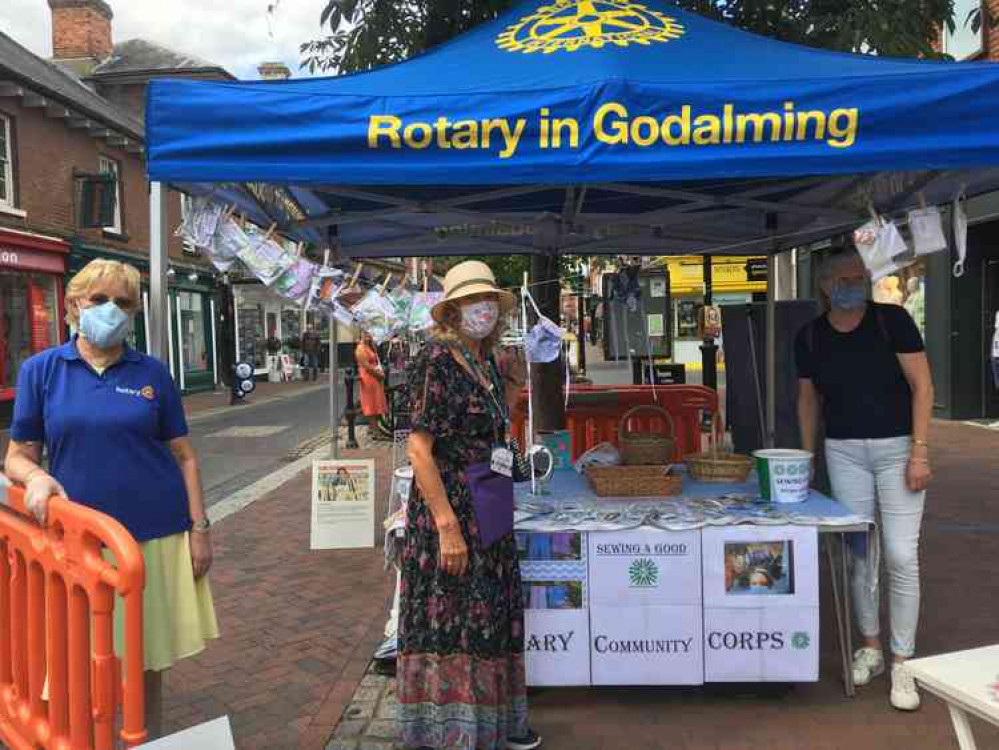 Liz Wheatley from Godalming Rotary, organiser Jennifer Mason and stitcher Rachel Edwards at the stall.