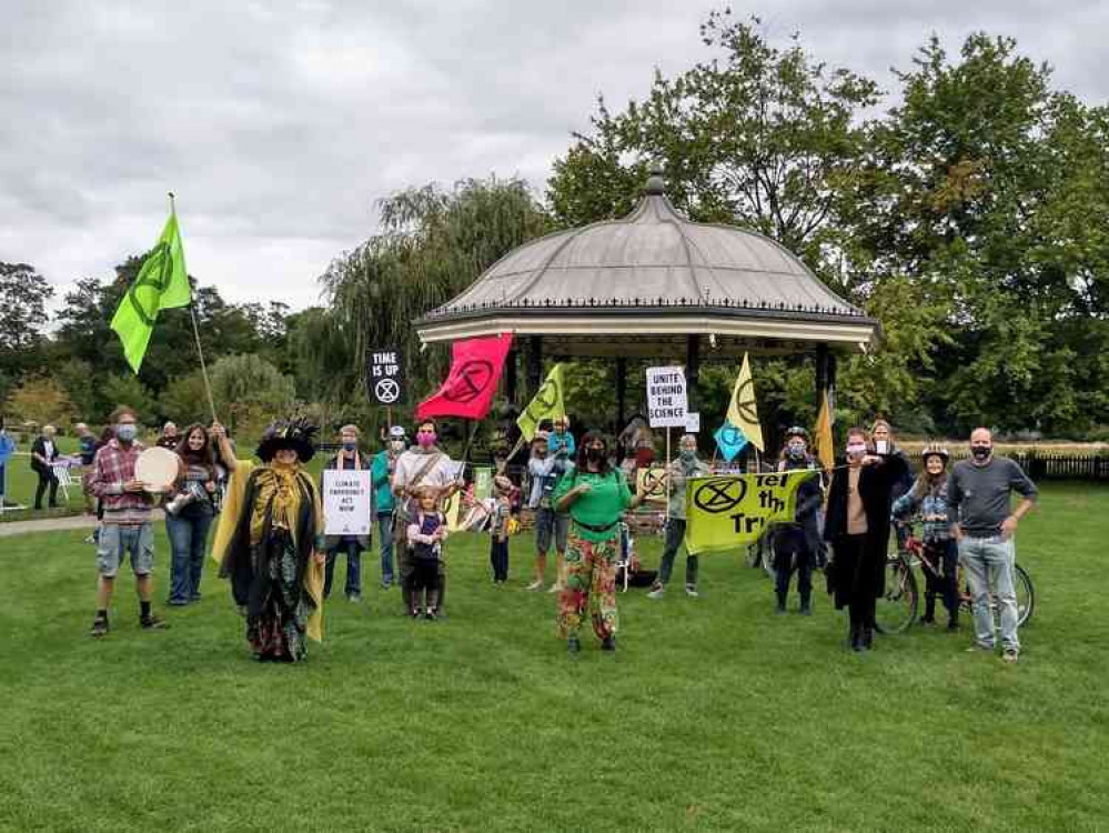 Protestors rallied at the bandstand before marching silently through the town.