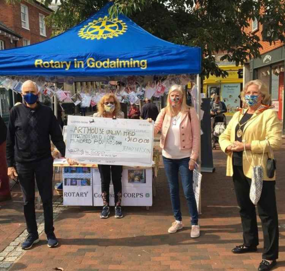 Arthouse trustee Colin Stokes receives the cheque from Godalming Town Mayor Penny Rivers.