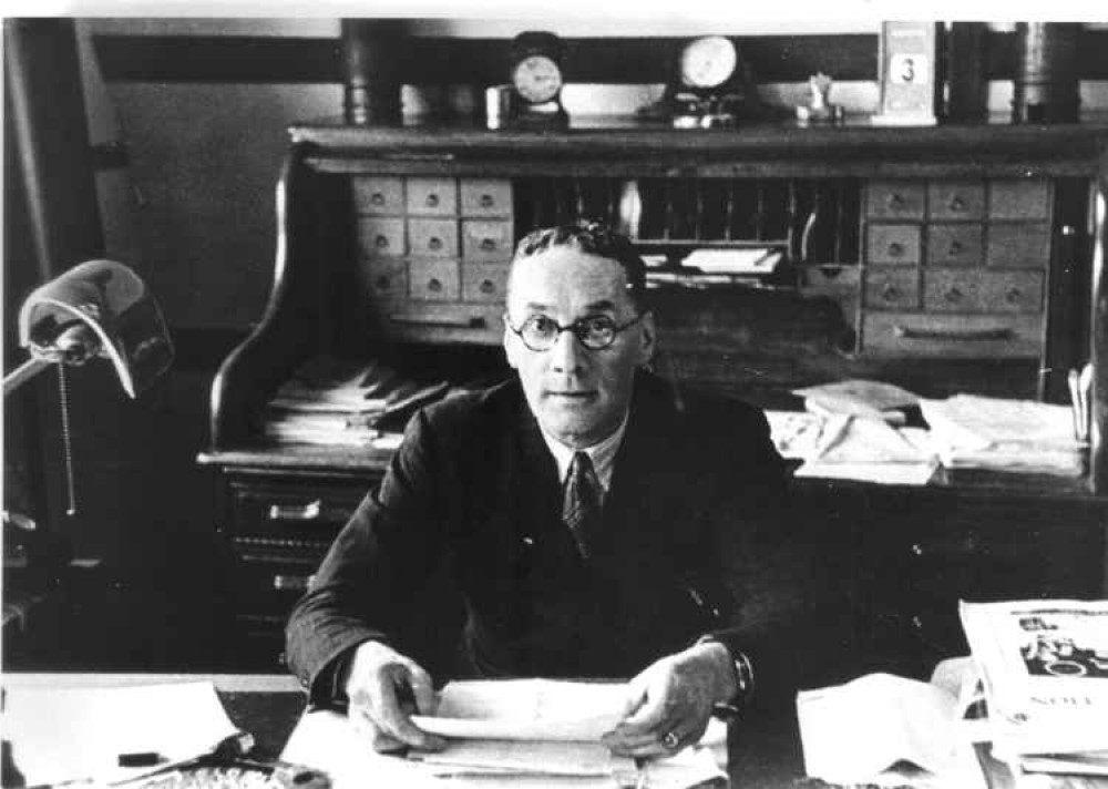 Reginald Foster Dagnall in his office in Stoke Road, Guildford, inthe early 1920s. Photo courtesy of Godalming Museum.