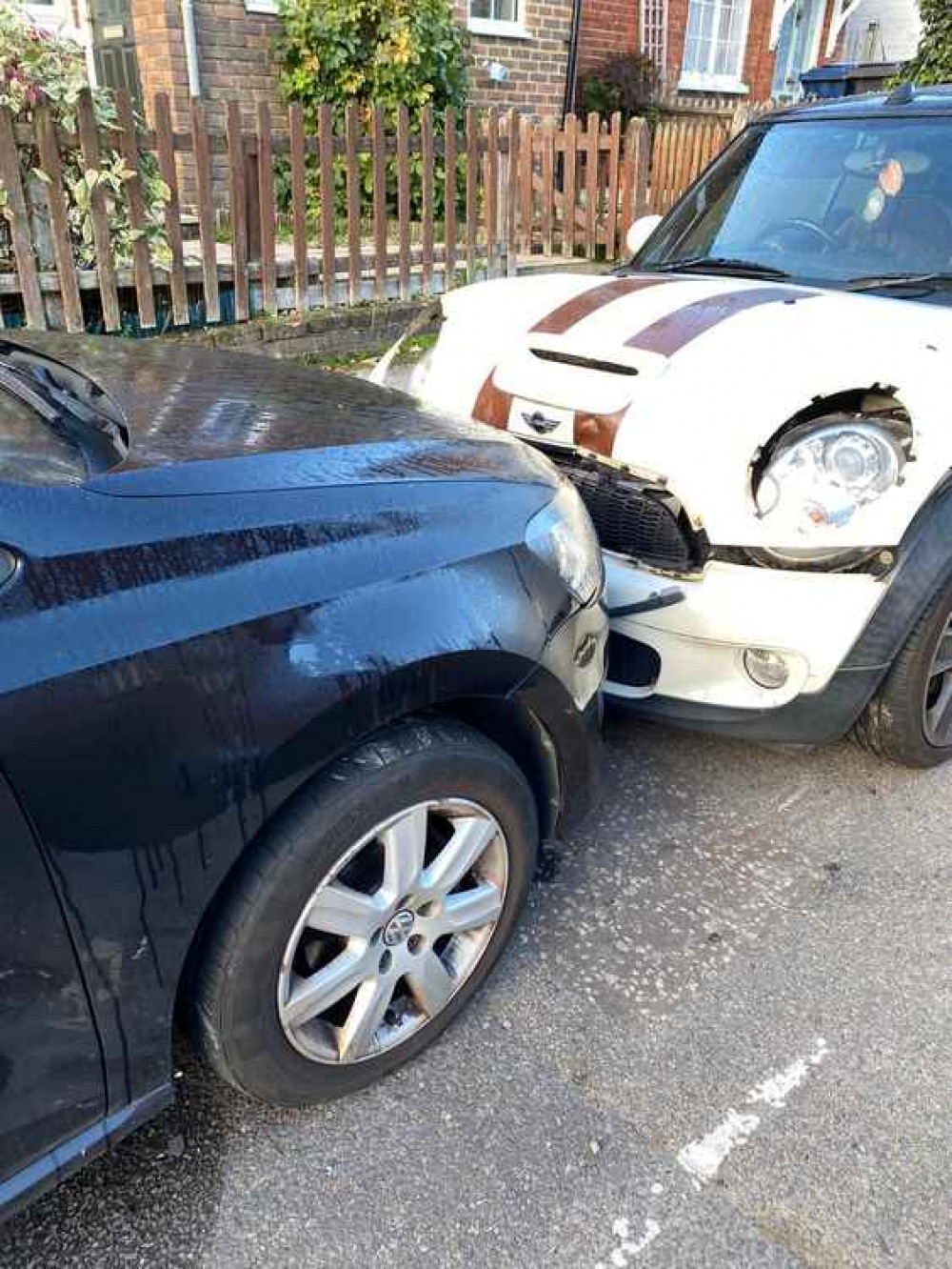 Damage caused to two parked cars in the accident.