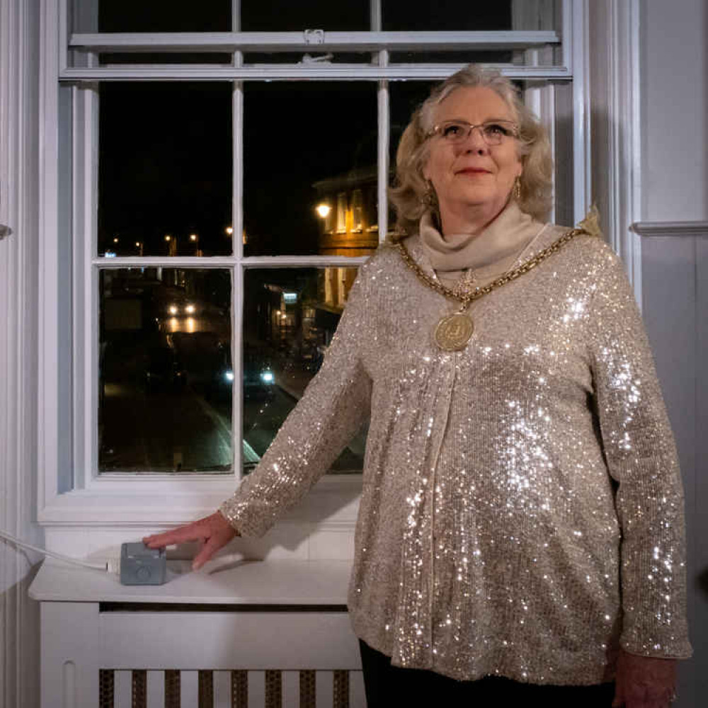 Mayor Penny Rivers switches on  the lights from her vantage point in The Pepperpot.