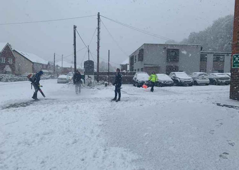 Local people cleared away the snow at the front of the ambulance station.