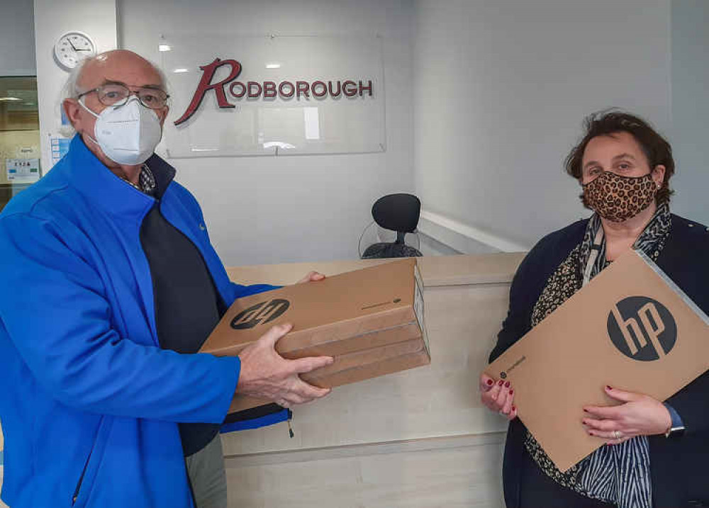 Colin Bryson presents Rodborough School Assistant Headteacher Judith Spencer with Chrome Books.