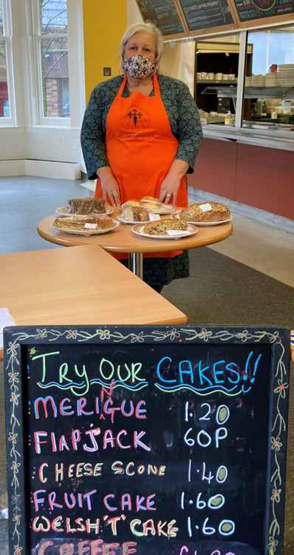 Cafe manager Debbie Portsmouth shows off some of the home-made cakes available to take away.