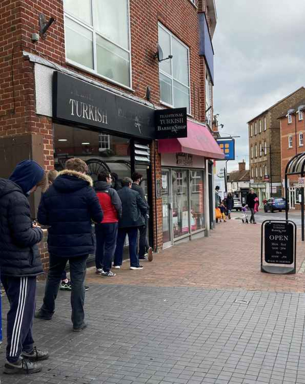 Queuing for the barber.