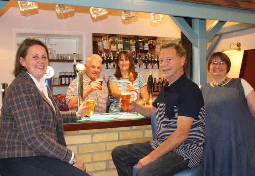 Toasting the new-look clubhouse; Cllr Westropp (front left) with committee members Rachel Southwood, Mick Norton, Jo Altham and Jeroen Jansen