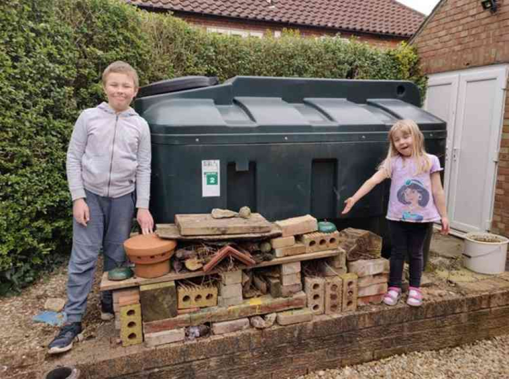 Coun Dr Peter Moseley's children, Oscar (10) and Rosalind (5) with their bug hotel.