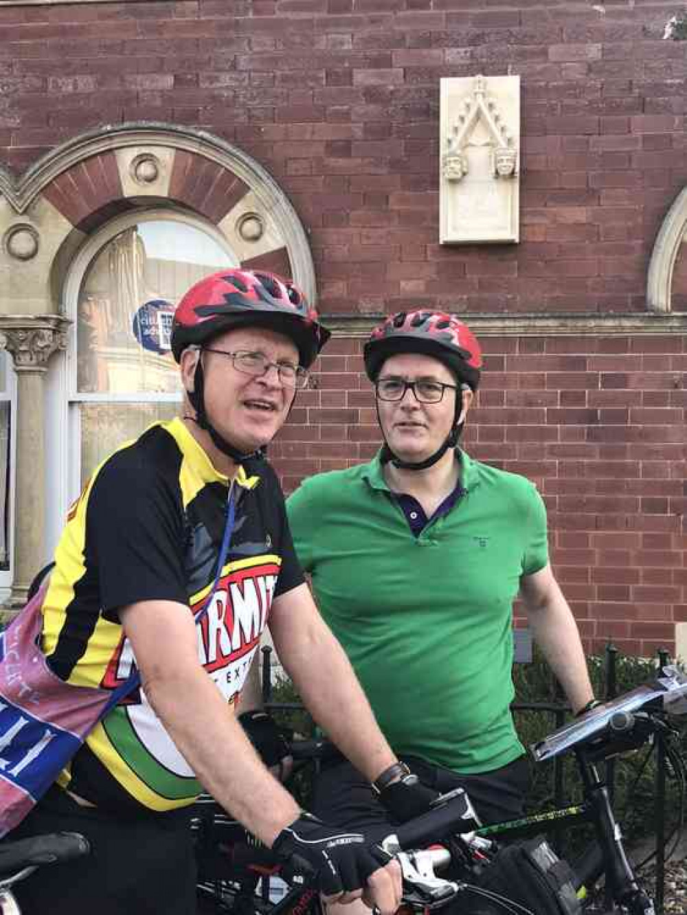 Queen Eleanor Cyclist, Peter Watson and Paul Tillott, opposite the Queen Eleanor memorial stone at Grantham Civic Centre