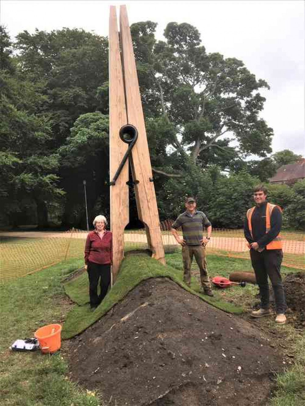 Pictured at the peg during the turf relaying work are, left to right, the secretary of Friends of QEP, Elizabeth Bowskill; sculptor Nigel Sardeson; and Fineturf's Business Development Manager, Harry Glenn.