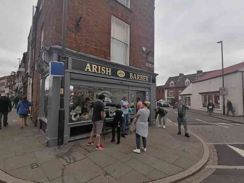 People outside a Turkish barber off Westgate