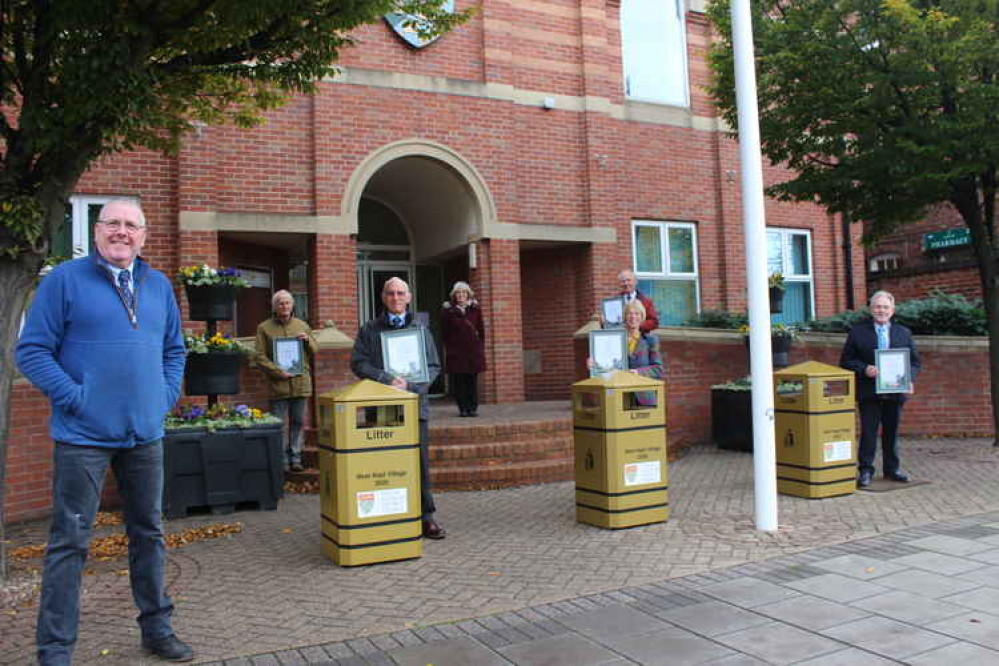 Best Kept Village winners collect their prizes with (from left) Cllr Dr Peter Moseley, gold litter bin winners Brian Ingliss (Barrowby)  Jenny Crow (Irnham) and John Plummer (Allington) with back (from left) Neil McCorquodale (Stoke Rochford) competition