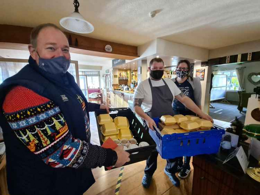 Welby parish councillor Michael Priestley (front), with Crown and Anchor chef and co-owner Peter Turner and Yasmine Baxter