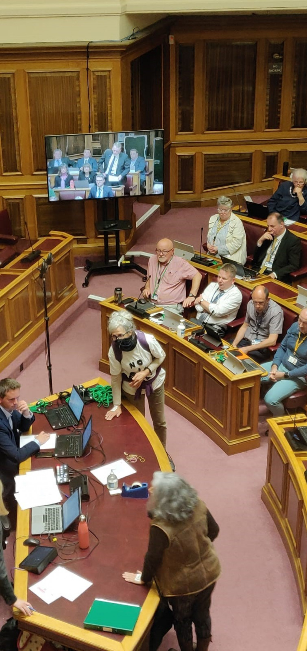 The moment the two protestors glued themselves to a desk in the council chamber