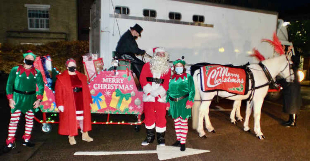 Hadleigh Foodbank Charity trustees Paul Shipperlee, Ruth Lucas and Angela Gregg with Santa, before the sleigh set off