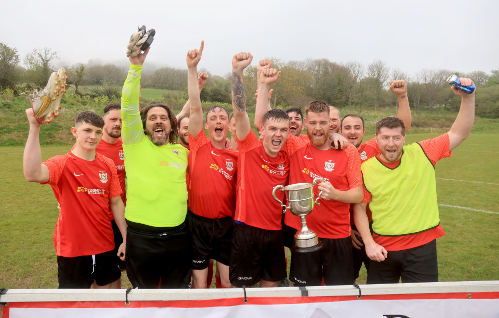 Charmouth celebrate after winning the Tommy Tabberer Cup for a third time Charmouth celebrate after winning the Tommy Tabberer Cup for a third time