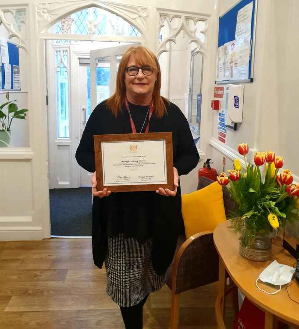 Jan Seal proudly shows Hadleigh Nursing Home's certificate from the Lord Lieutenant.