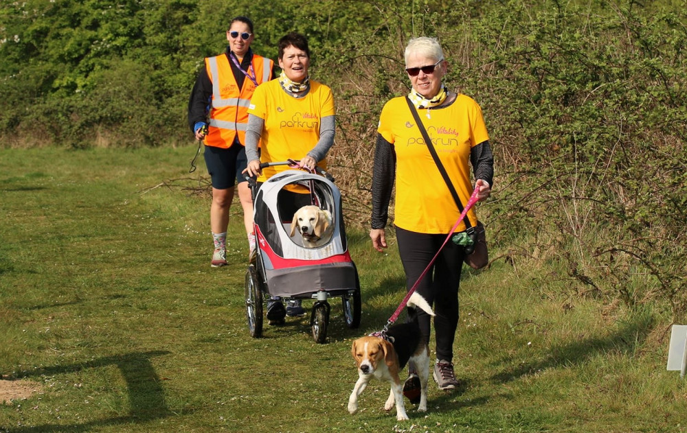 Two walkers with their dogs accompanying the parkrun tailwalker volunteer (credit: Terry Wright) Two walkers with their dogs accompanying the parkrun tailwalker volunteer (credit: Terry Wright)