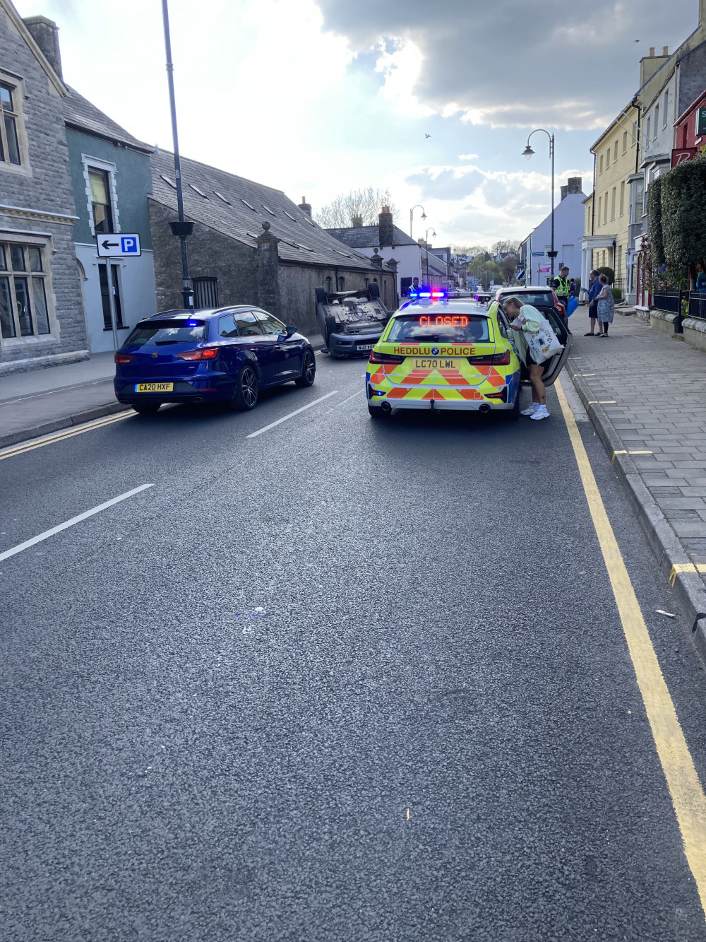 An Audi A3 was in collision with a parked car and tipped onto its roof. (Image credit: Charles Champion)