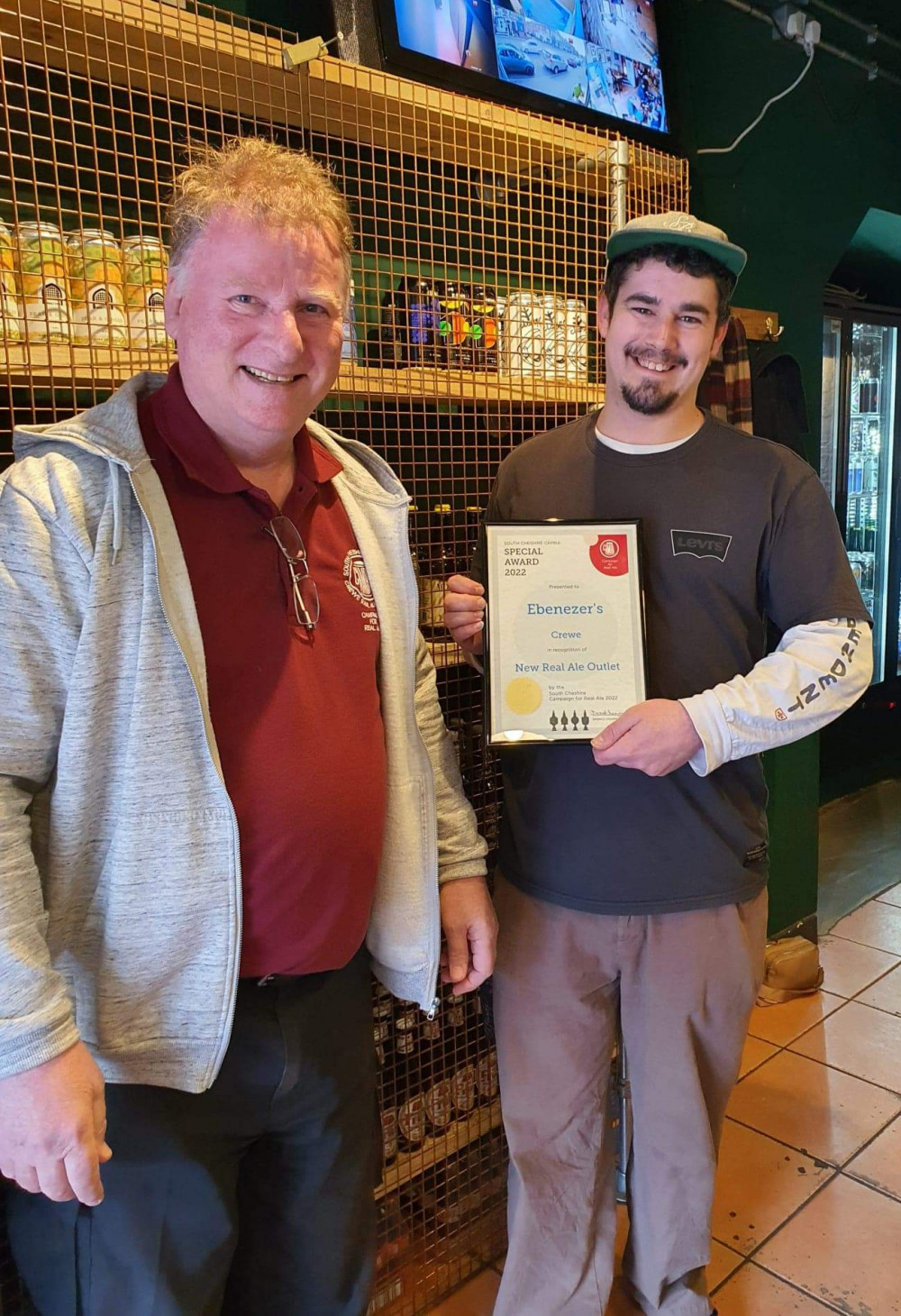 Manager of Ebenezer's Crewe, David Atwood, holding the 'new outlet for real ale' award (South Cheshire CAMRA branch).