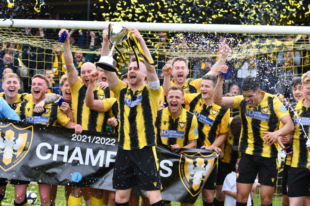 Falmouth Town get their hands on the trophy. 