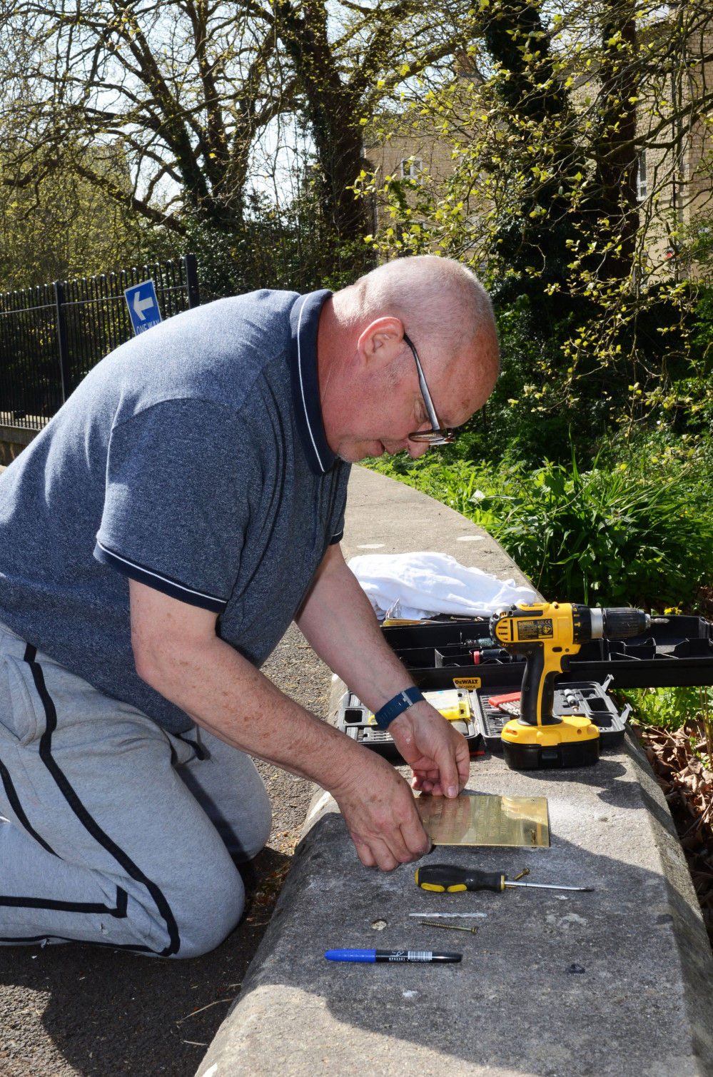 Martin attaches the plaque in Radstock 