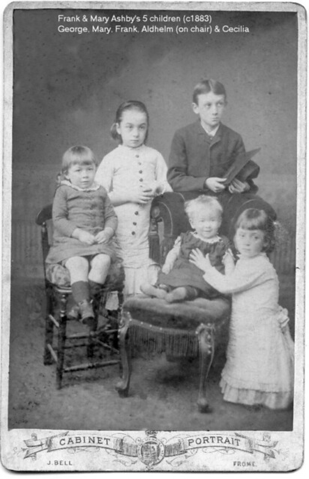 He is the child on the chair and died in 1958 aged 76