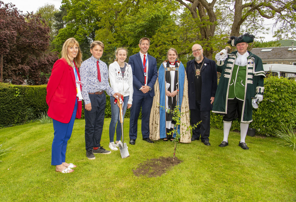 (From left to right) Tracey Hazel, Bertie, Elis, Dan Thornburn, Reverend Kitto, John Cousins and Andy Neal with the Glastonbury Thorn Tree