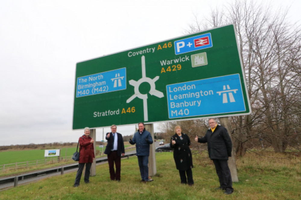 Council leaders posed for a photo op at Longbridge Roundabout after submitting the request to government in December