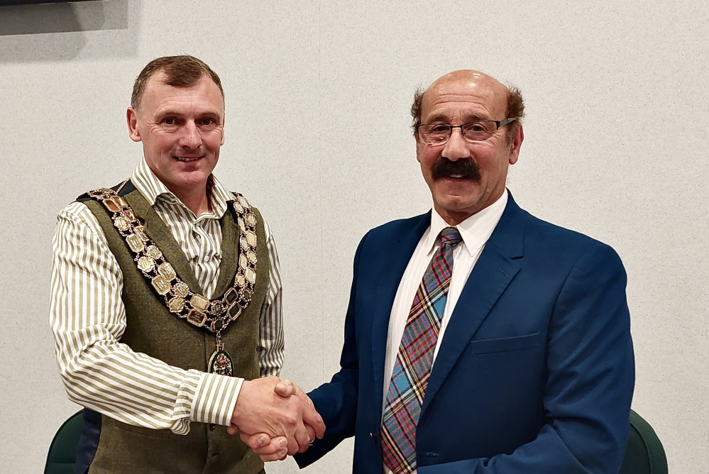 Outgoing Chairman Councillor Virge Richichi (right) hands over the chains of office to the new Chairman Councillor Russell Boam (left)   