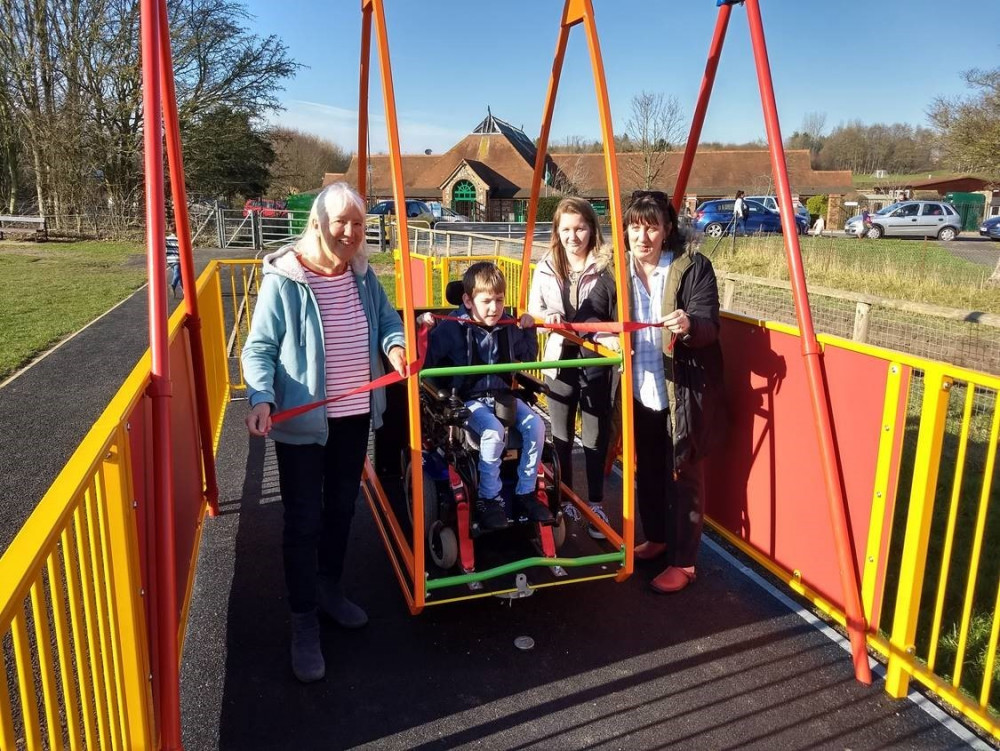 Councillor Stella Jones, Denise Smith (grandmother), Freddie Palmer and sister Hannah Palmer when the swing was opened in February 2019.