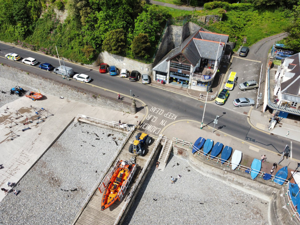 A dog and its owner were saved from the Penarth cliff edge. (Image credit: GMDronesUK - Twitter)