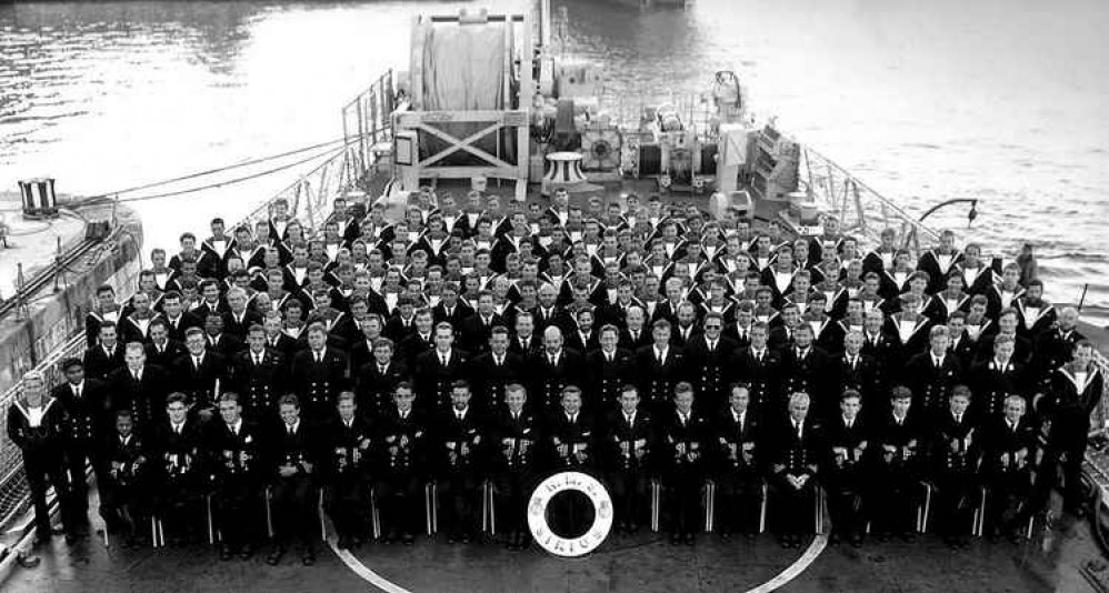 Frank Minns as a Lt Cdr pictured with crew on board HMS Sirius