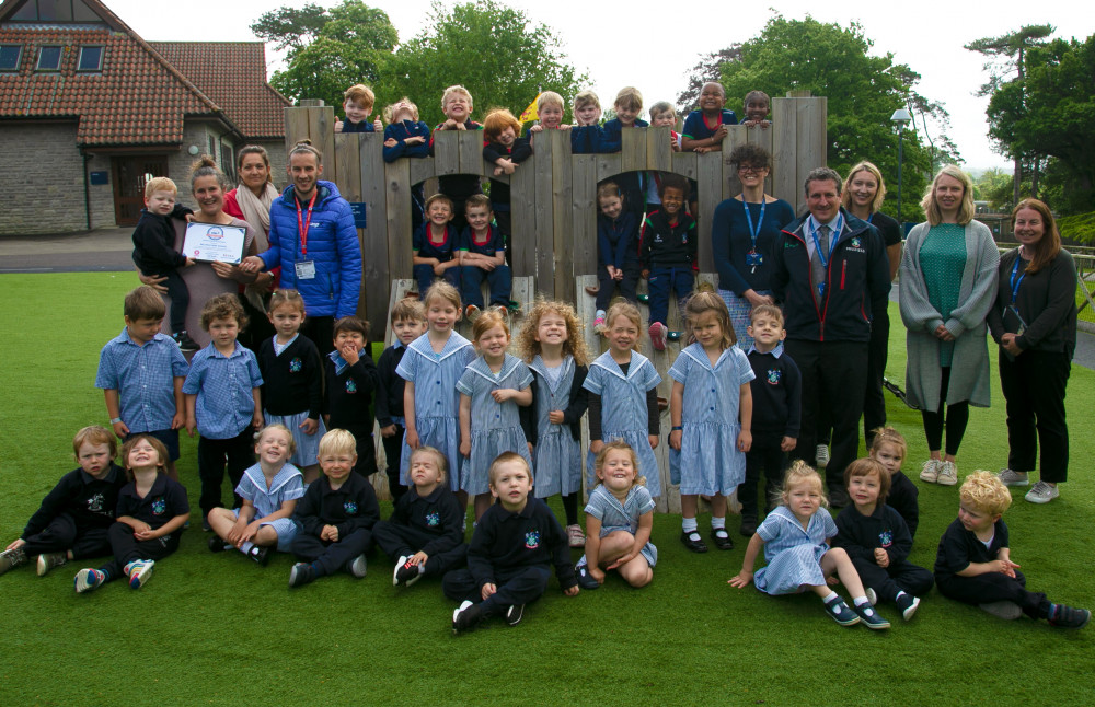 Early Years Foundation Stage (EYFS) staff and pupils presented with a certificate