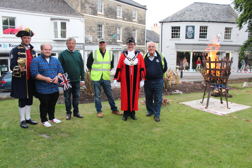 The Mayor of Axminster, Cllr Jill Farrow, pictured with members of Axminster Carnival Committee at the lighting of a brazier on Minster Green