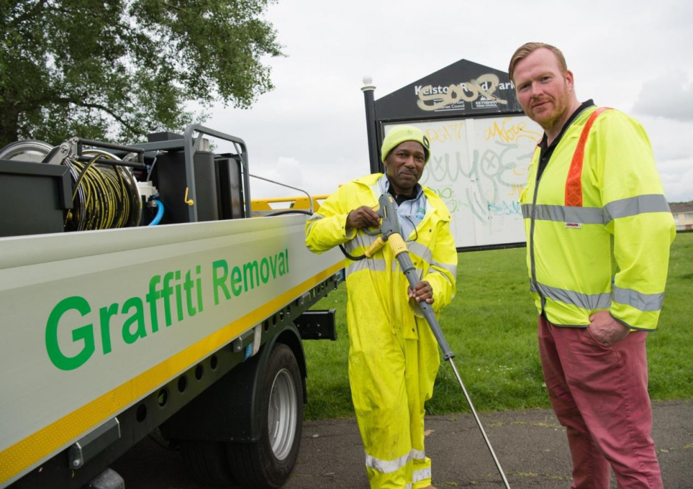 Councillor David Wood, cabinet member for Neighbourhood Services, with a member of the graffiti removal team.