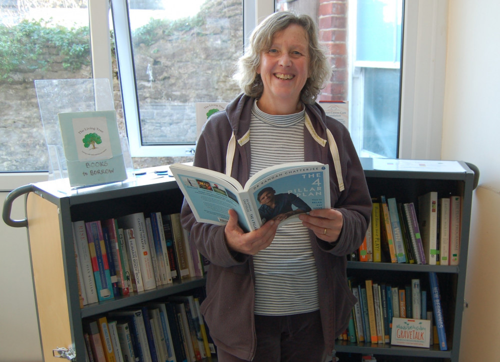 Our out-going admin assistant, Rose Thorpe, browsing the books in the Living Tree library. Our out-going admin assistant, Rose Thorpe, browsing the books in the Living Tree library.