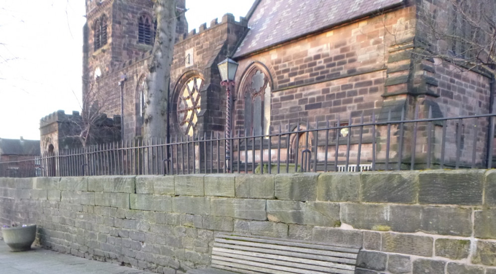 Repair work has started on the walls outside the church.