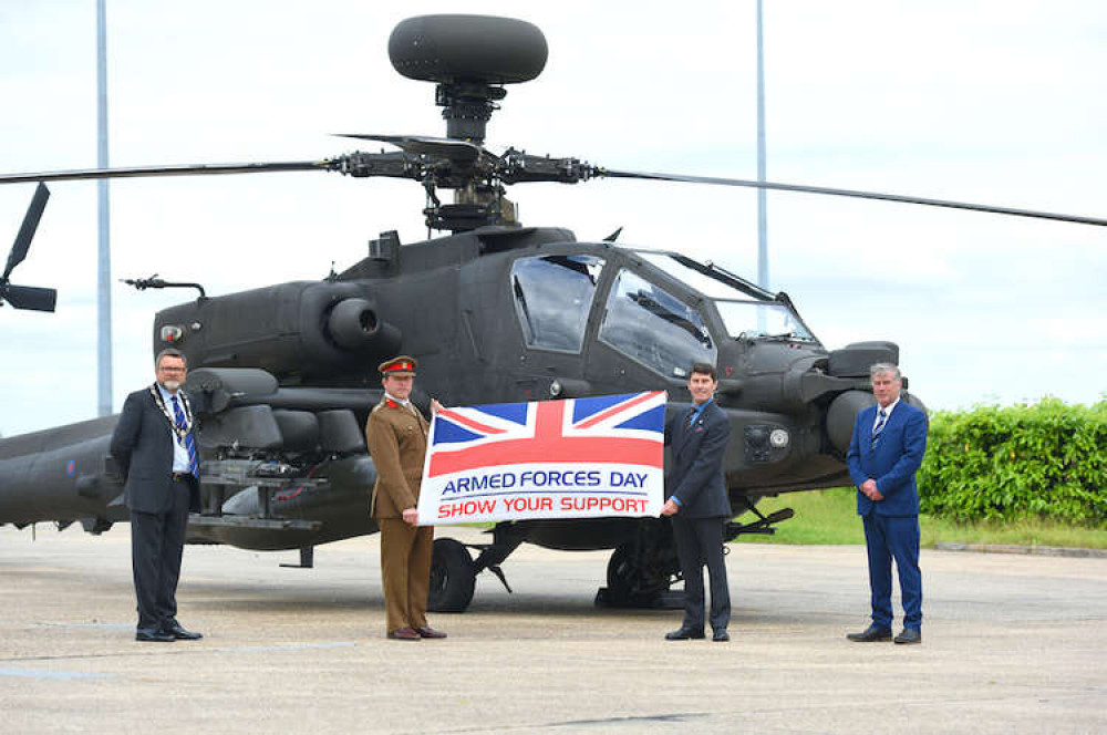 Mayor Frank Minns, along with Hadleigh district councillor Mick Fraser at Wattisham Flying Station with an Apache helicopter that flew in Afghanistan