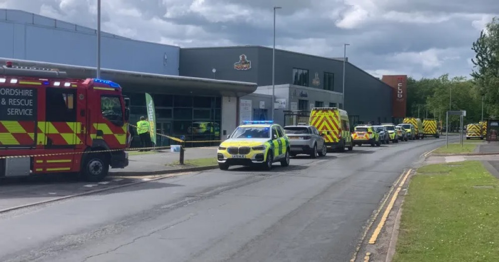 Emergency services outside Waterwold, Festival Park, Stoke-on-Trent. Two people were taken to hospital, with 46 treated at the scene. (West Midlands Ambulance Service).