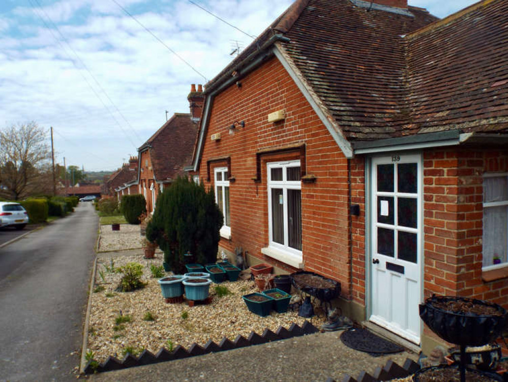 Almshouse with church in background