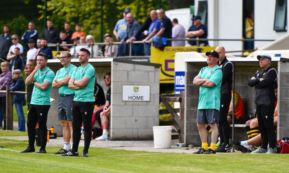 Andrew Westgarth and his team analyse from the touchline. Credit: Falmouth Town FC/Cornwall Sports Media.