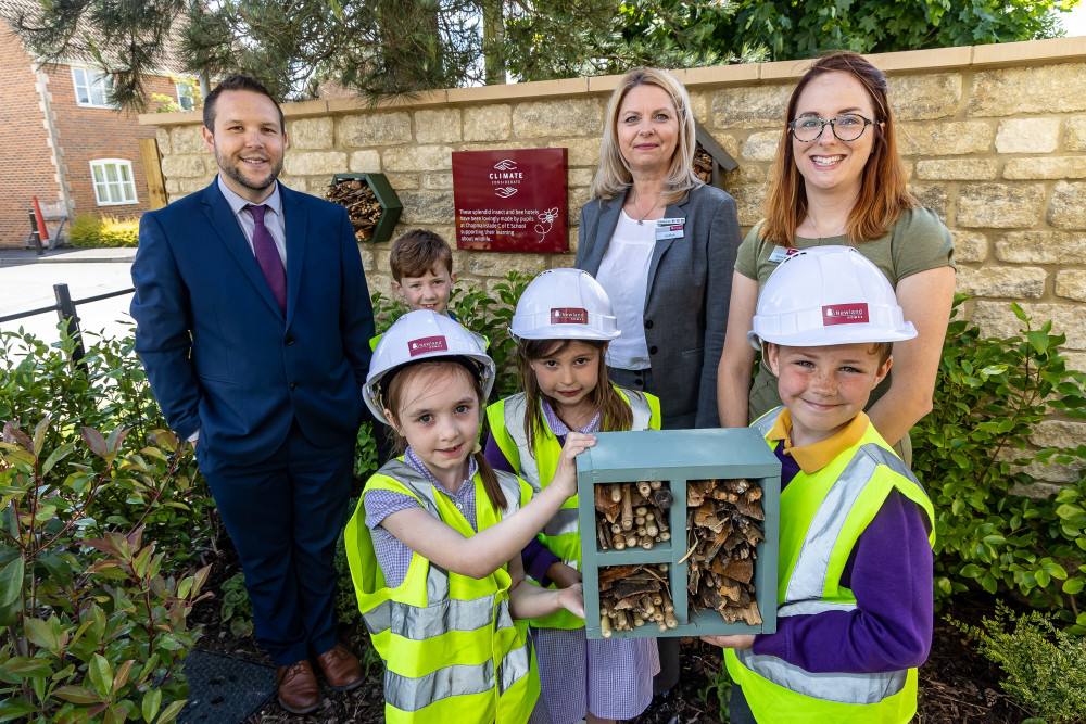 Pupils from Chapmanslade Primary School, with (from left to right) Rob Cottrell, Acting Head Teacher, Evelyn Slimman and Alison Bowen from Newland Homes.