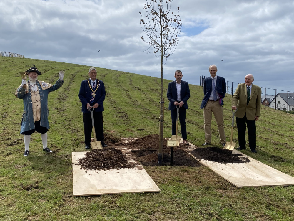 Town Crier Roger Bourgein, Exmouth Mayor Cllr Steve Gazzard, Lord Clinton and Taylor Wimpey staff at the initial planting of the tree which was attended by Cllr de Saram Town Crier Roger Bourgein, Exmouth Mayor Cllr Steve Gazzard, Lord Clinton and Taylor Wimpey staff at the initial planting of the tree which was attended by Cllr de Saram