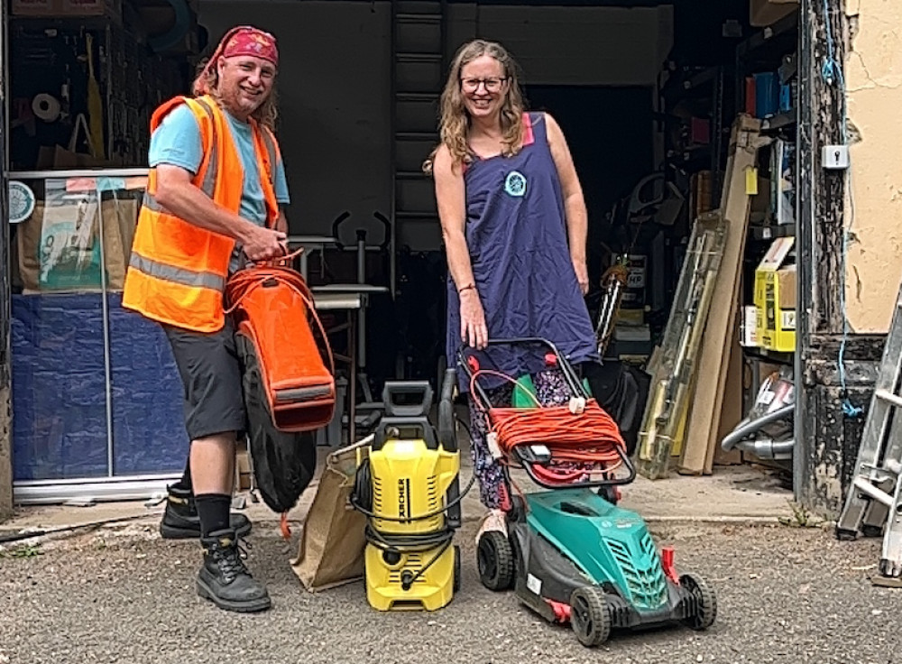 Benthyg Penarth team showing off a selection of items available to borrow at low-cost. (Image credit: Ella Smillie)