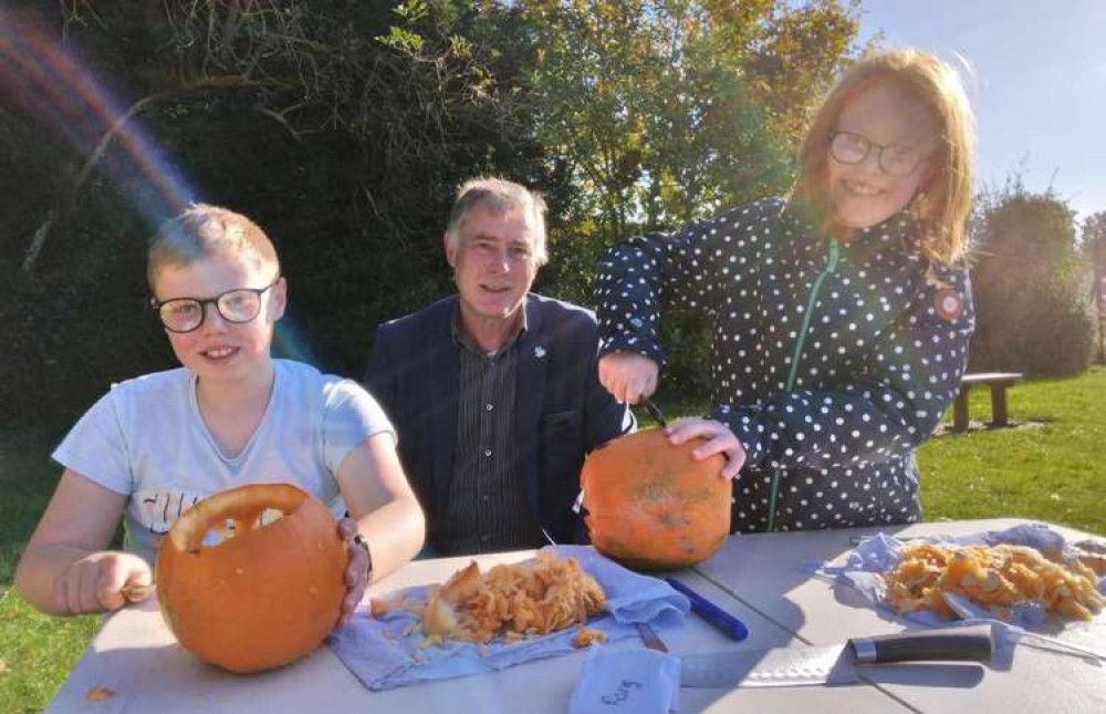 Babergh cabinet member Derek Davis pumpkin carving at park activities day