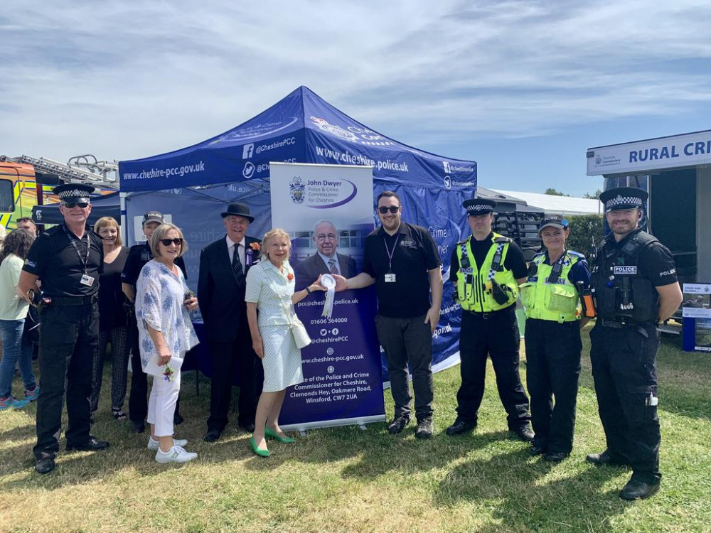  Cheshire Show organisers award the runner up rosette for Best Trade Stand to the police stand.