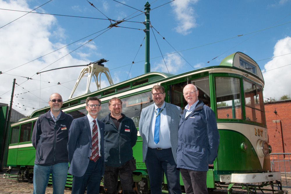 Photo courtesy of NET. Pictured during tram testing ahead of the relaunch of services at Crich, with one of the new masts in the background, are (left to right): Dr Mike Galer, General Manager of Crich Tramway Village; NET Technical Manager Phil Terry; Graeme Wigglesworth, Engineering Manager at Crich Tramway Village; Trevor Stocker, NET Head of Operations; and Glenn Oakes, NET Infrastructure Manager.