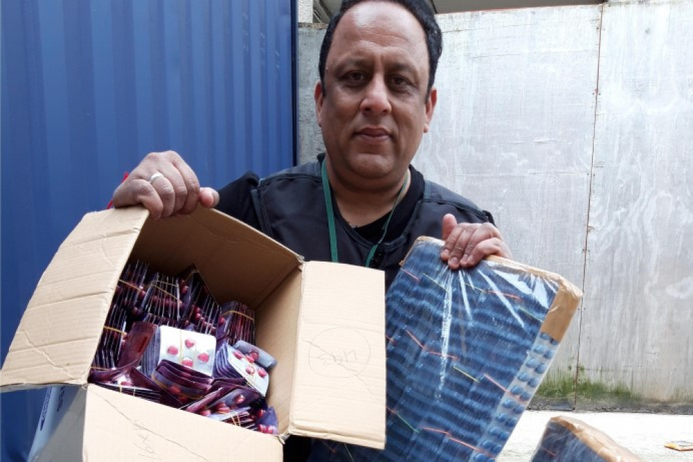 Senior trading standards officer Tariq Mohammed with some of the medicines found in the operation (Image: Ealing Council)